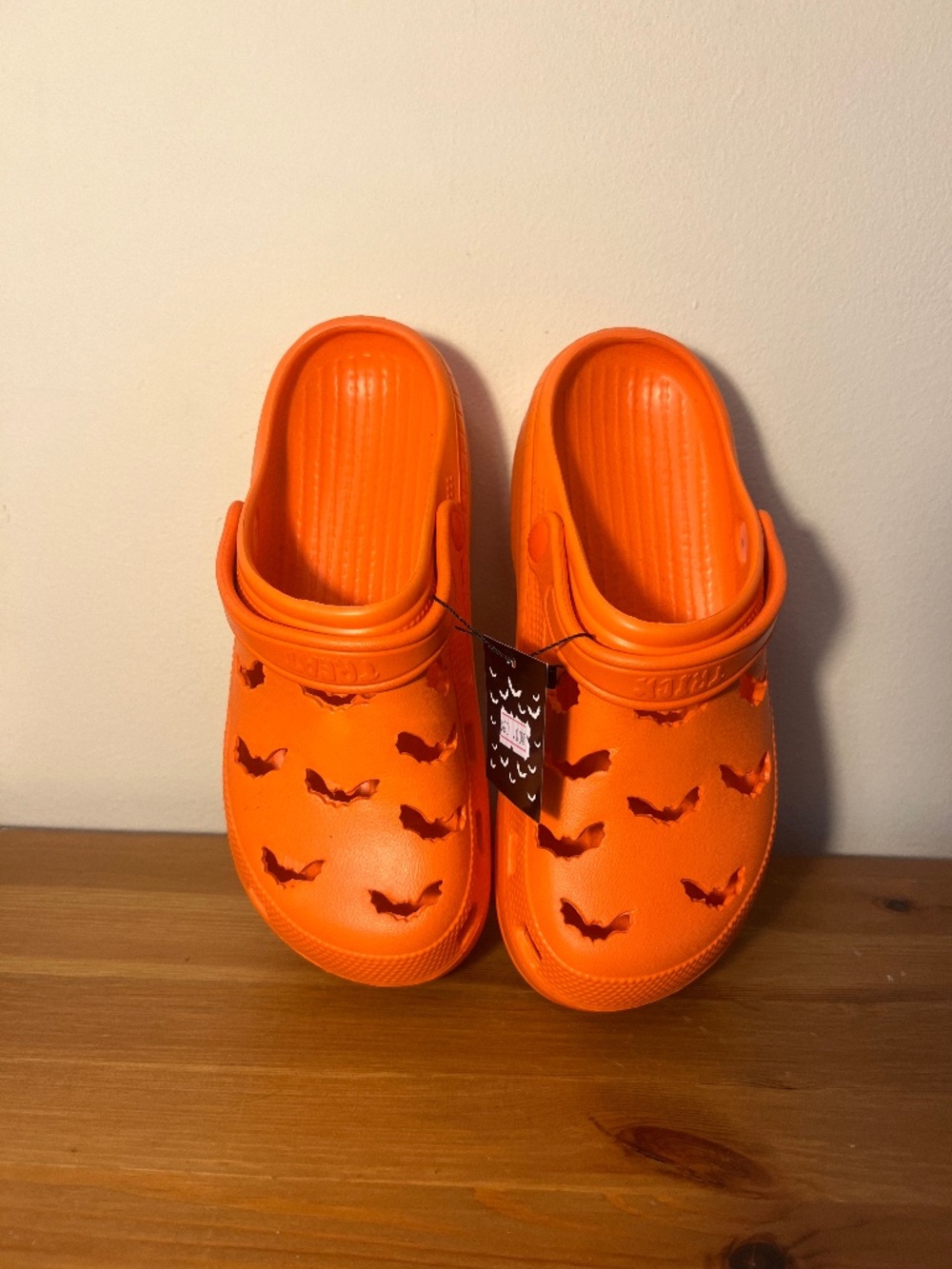 Strange Cvlt Bright orange bat crocs